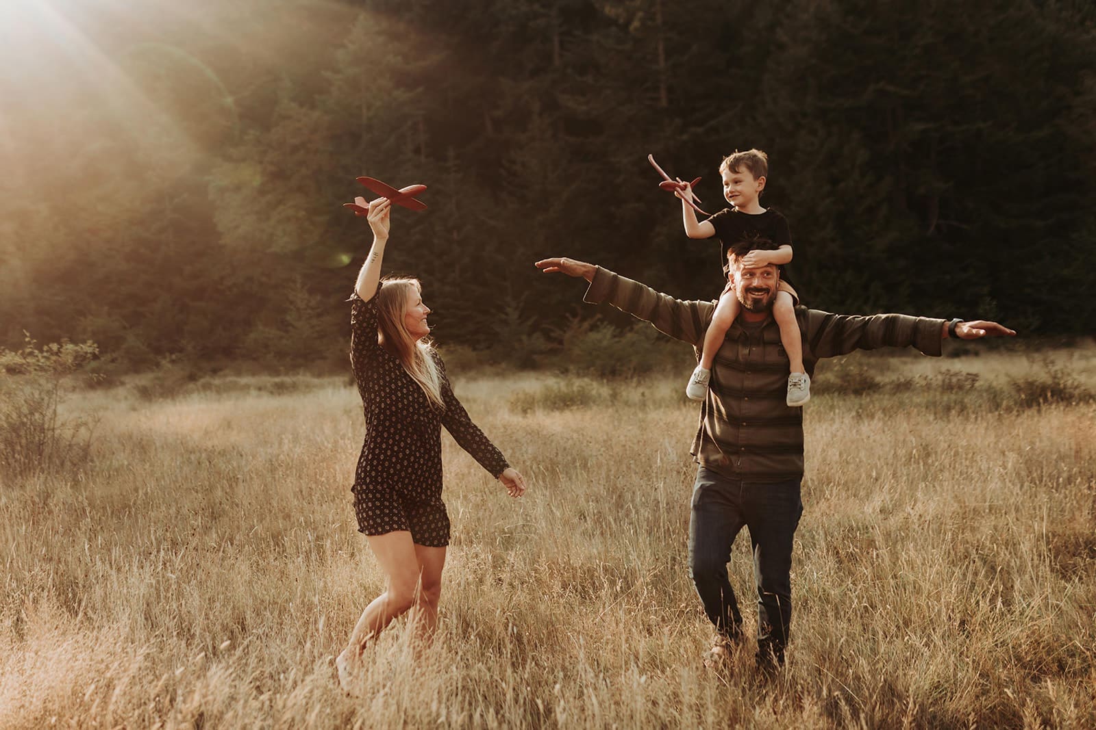 Family on an adventure flying toy airplanes in Victoria, BC