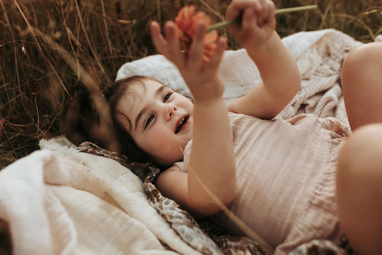 young child enjoying a farmers market outing