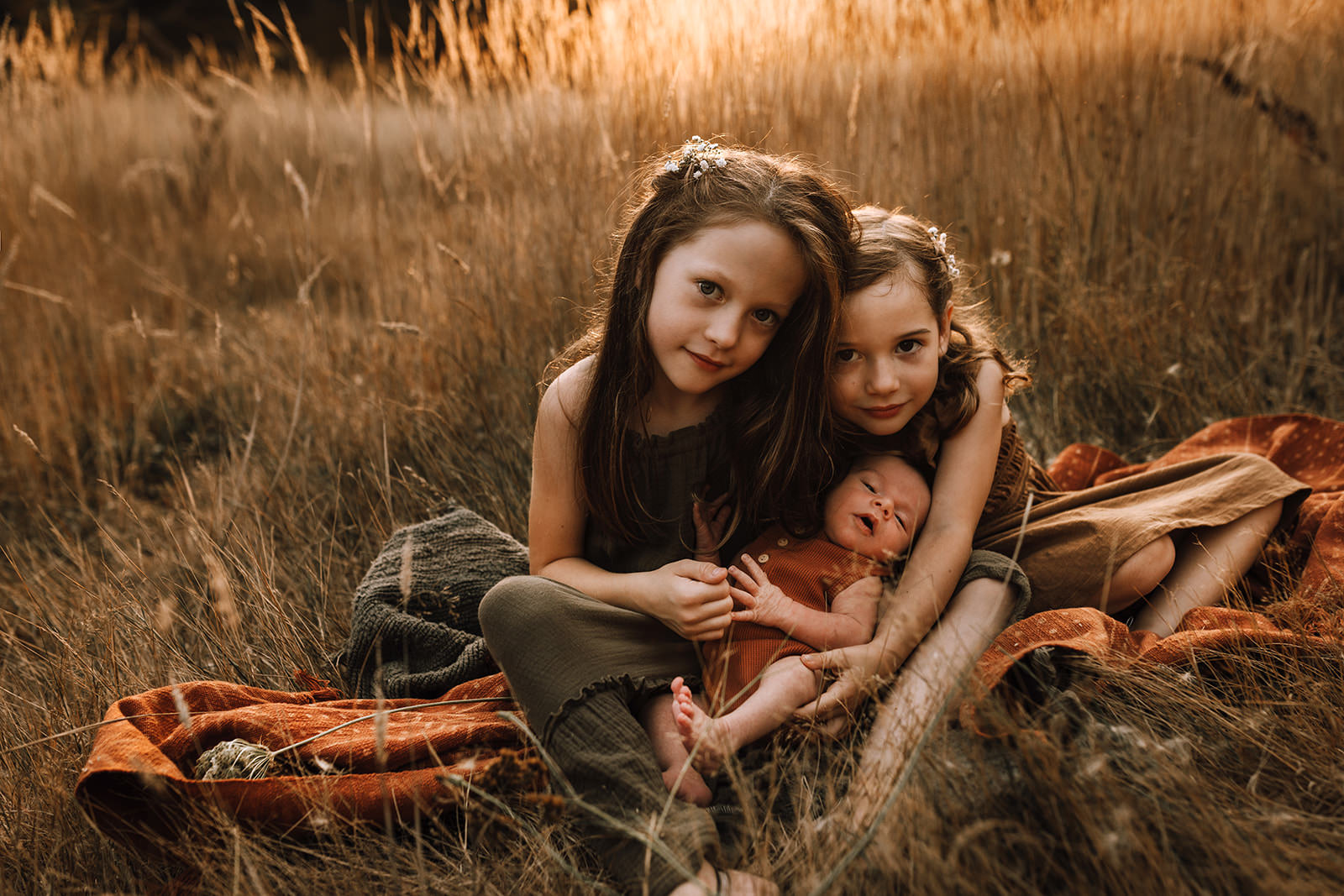 children in the golden light of a pumpkin patch in Victoria bc